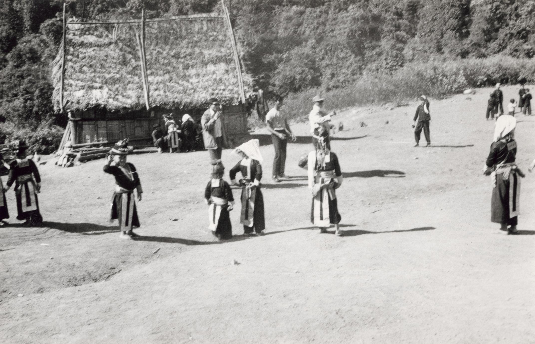 White Hmong youth playing catch ball in Houa Khong Province