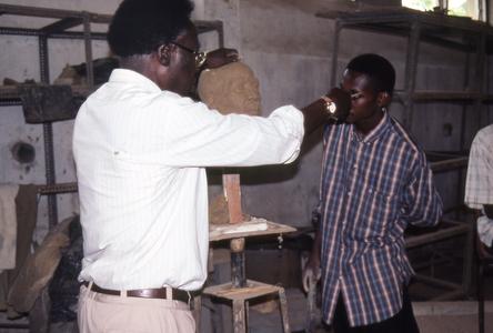 Agbo Folarin with student