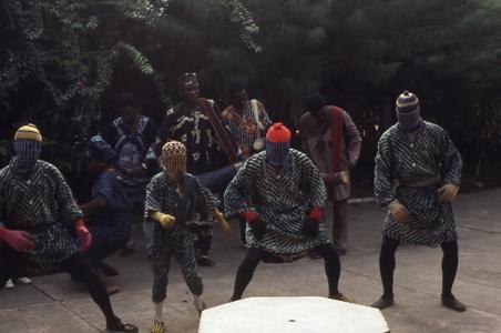 Group performing in masquerade at the Nike Centre for Art and Culture