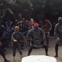 Group performing in masquerade at the Nike Centre for Art and Culture