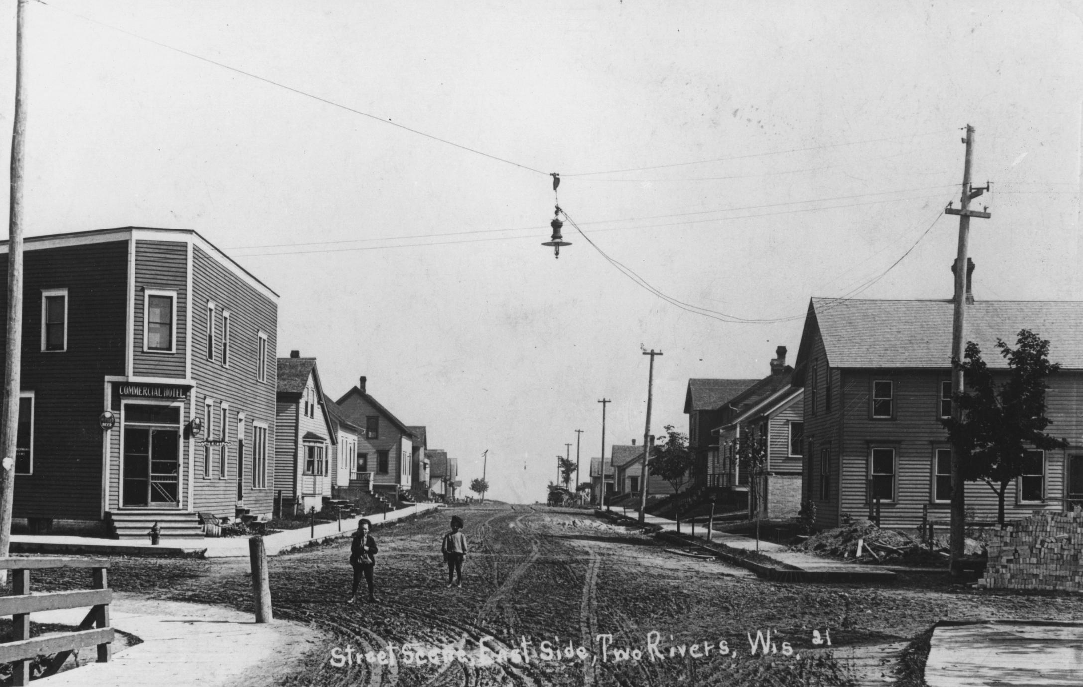 View of street in early days of Two Rivers, Wisconsin.