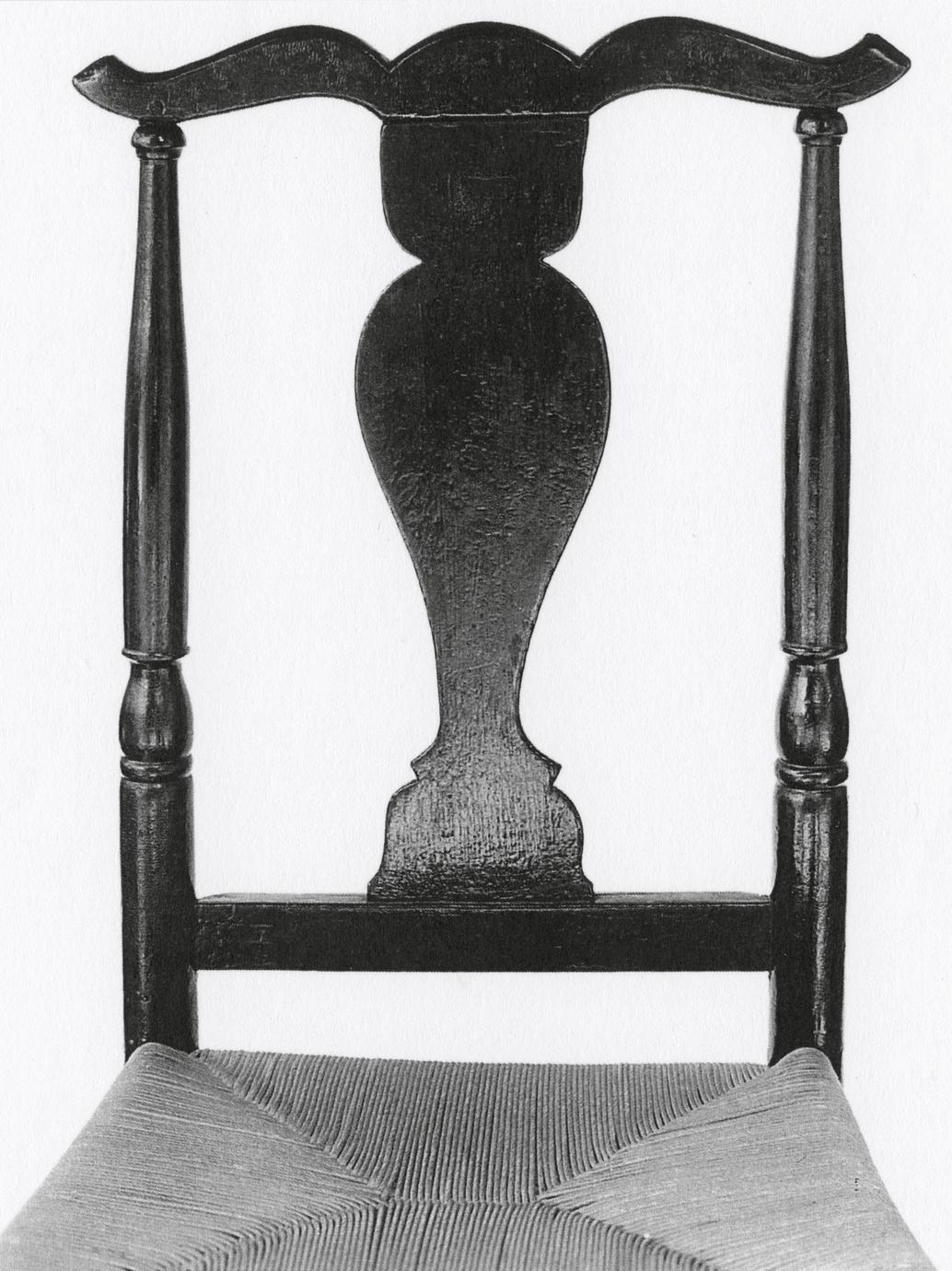 Black and white photograph of a "splat-back" side chair back.