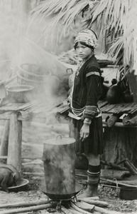 Woman steaming rice in the Akha village of Phate in Houa Khong Province