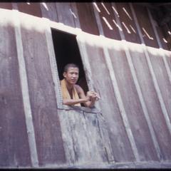 Phetsarath trip : smoking bonze at window of his residence in vat compound