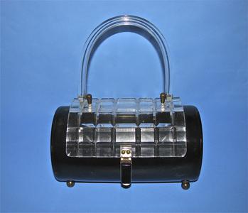 Black Lucite purse with a cylindrical body