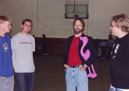 Philosophy professor Mark Peterson with students in gym