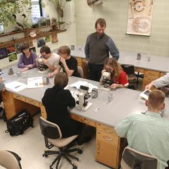 Students use microscopes during biology lab