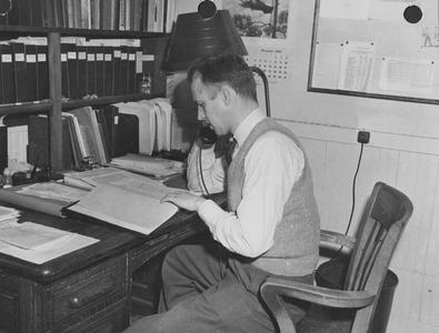 F. R. Zimmerman at desk