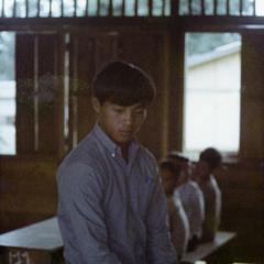 A Hmong student teaches in a village school in Attapu Province