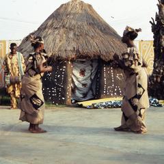 Two women dancing at masquerade
