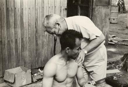 Kong Le is examined by an American physician