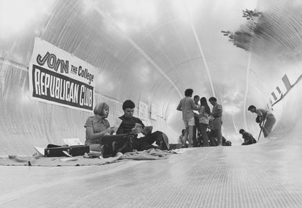 Students in opaque tunnel promoting student organizations