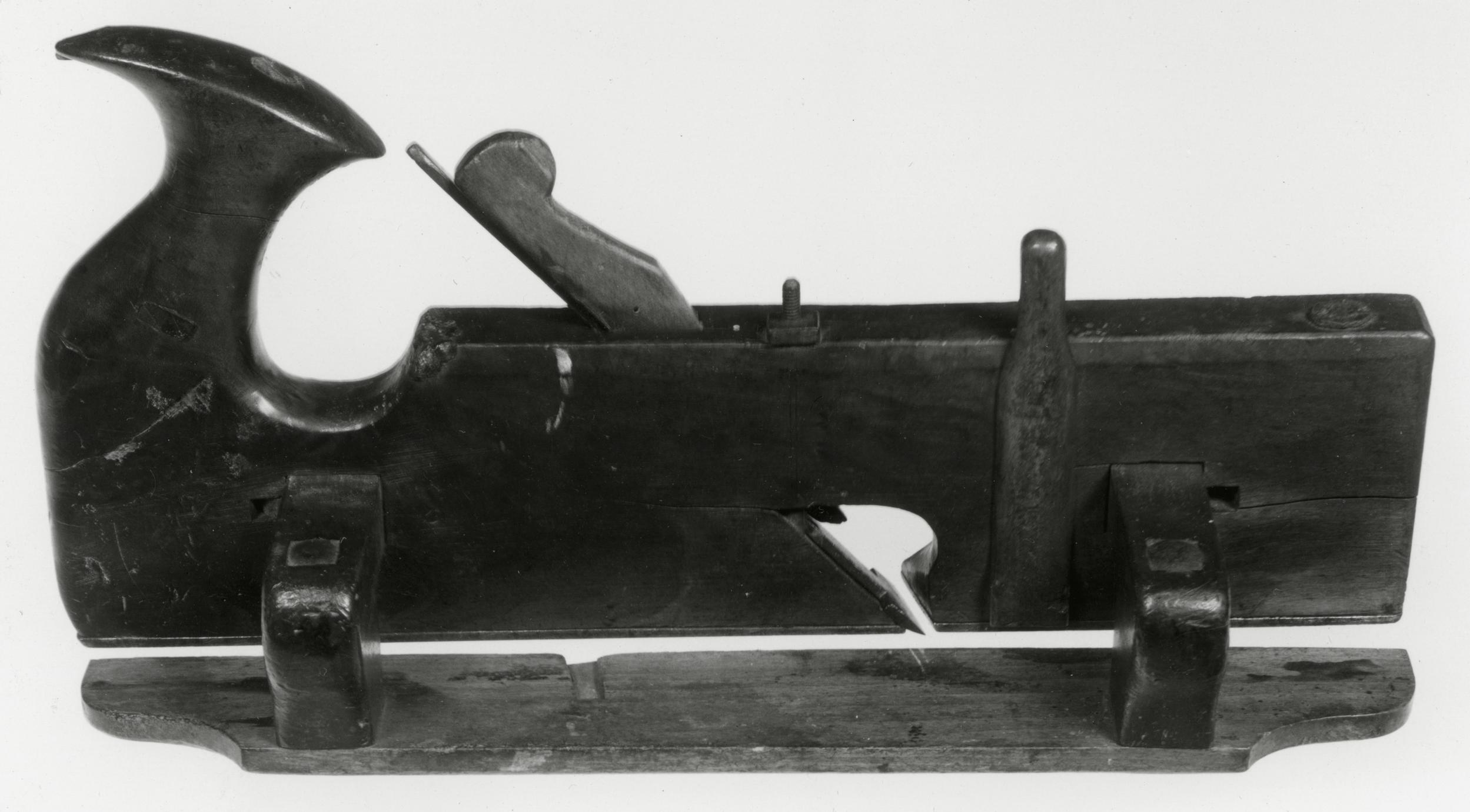 Black and white photo of a sash fillister plane, or skew-rabbet with adjustable fence.