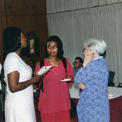Dean Mary Rouse and students talk at 1995 graduation reception