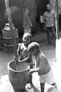 Children Playing with Mortar and Pestle