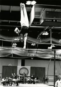 Male gymnast using horizontal bar