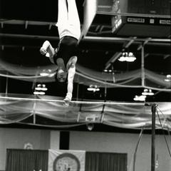 Male gymnast using horizontal bar