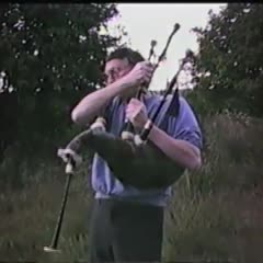 Stanley Robertson plays the bagpipes at his family's old campground (video)