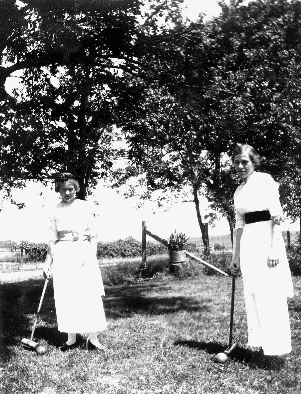 ‎Frances and Helen Healy playing croquet UWDC UWMadison Libraries