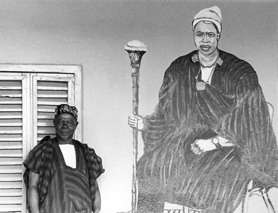 A Paramount Chief Next to His Coronation Portrait