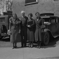 People in front of car