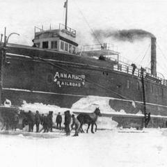 Men and horses work to free the Ann Arbor No.1 from the ice