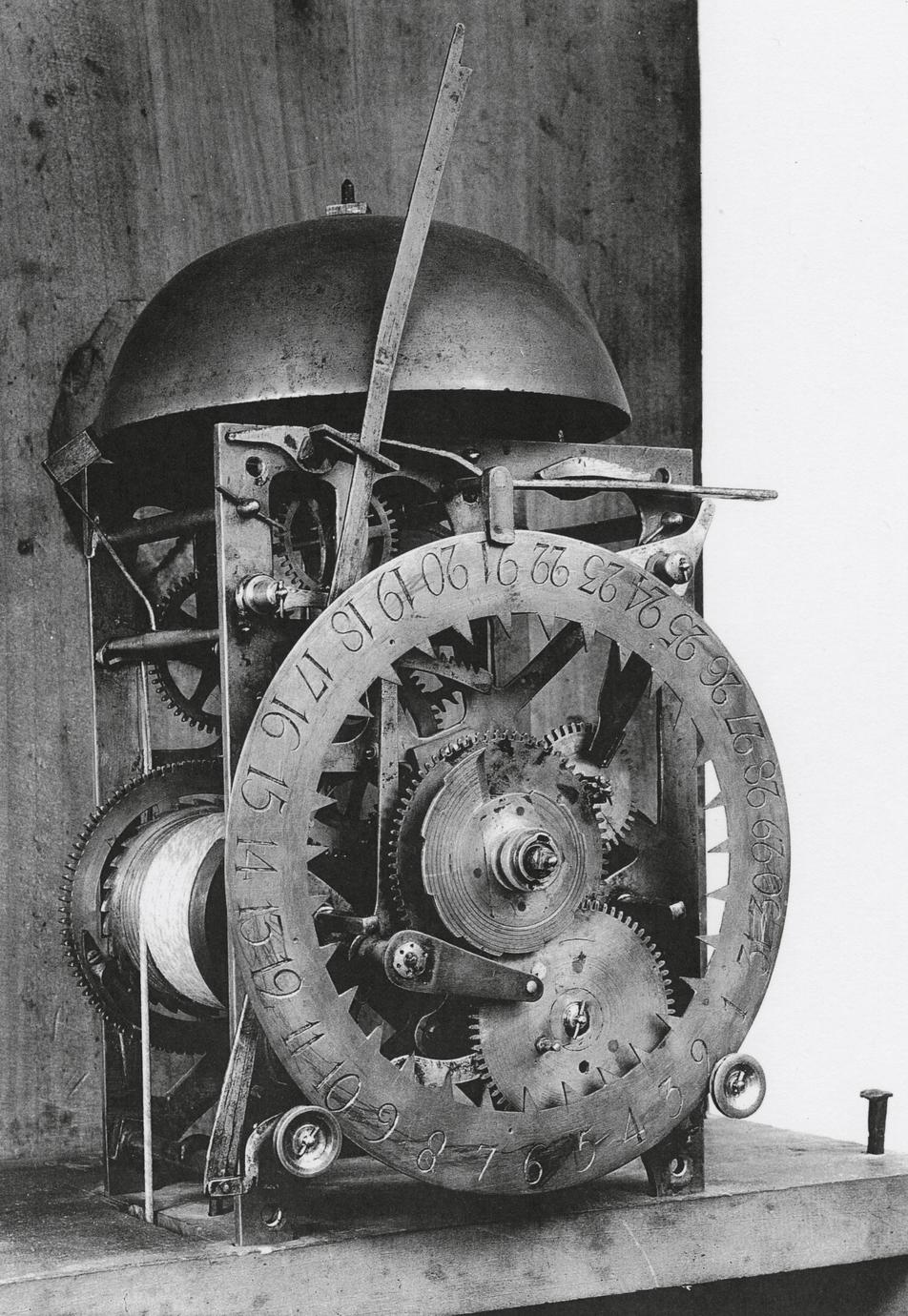 Black and white photograph of an eight-day, strike, repeater clock gear system.