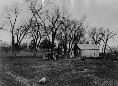 Side view of the Shack, ca. 1935-1936, car in drive