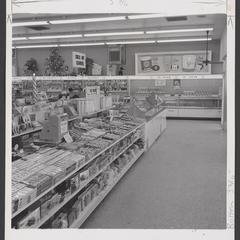 Interior of drugstore with two cash registers by the ice cream section