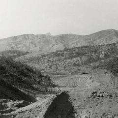 "Hillsides mostly barren from napalm".