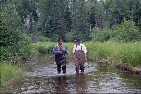 Amina Pollard and Kelly Melville walking upstream