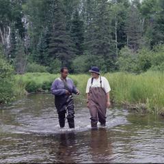 Amina Pollard and Kelly Melville walking upstream