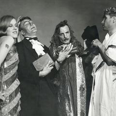 Four people in various costumes