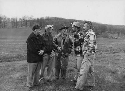 Ernest F. Swift and staff discussing farm-forest-field day
