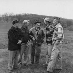 Ernest F. Swift and staff discussing farm-forest-field day