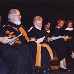 Professors on stage at commencement ceremony