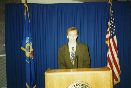 Stout Student Association, John Houder standing at podium