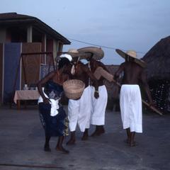 Dancers with hats and baskets