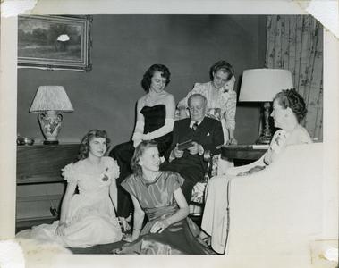 Advisor Anne Marshall and others sitting with Alpha Phi members