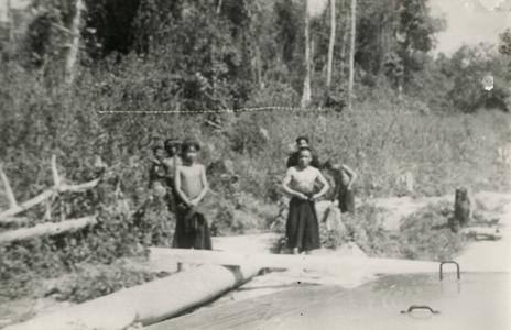 Akha men standing next to the road near the village of Phate, Houa Khong Province