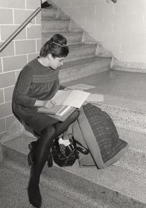 Student studying in stairwell