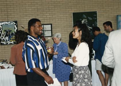 Two students talk at 1995 graduation reception