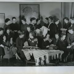 The Hyperian Society group photograph, looking at textiles