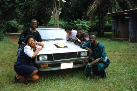 Group of interviewees posing by car