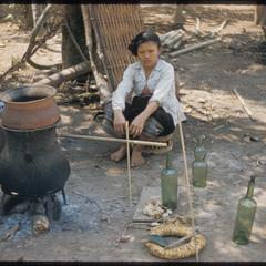 Woman distilling shoum