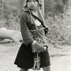 Akha woman walking on a path near the village of Phate in Houa Khong Province