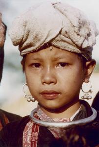 A Yellow Lahu (Lahu Shi) girl poses in her village in Houa Khong Province