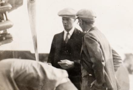 Lindbergh and unidentified men at Pennco Field, Madison