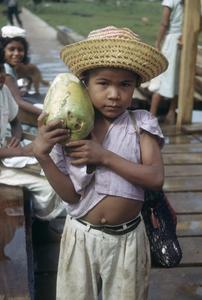 Girl with papaya fruit, Los Chiles