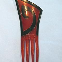 Red angular asymmetrical comb